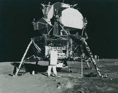 NASA NASA. Apollo 11 mission. Astronaut Buzz Aldrin retrieves from the lunar module...