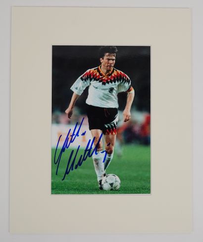 null Soccer / Matthaus / Autograph / Photo. On a color action photo (19,5x13), mounted...