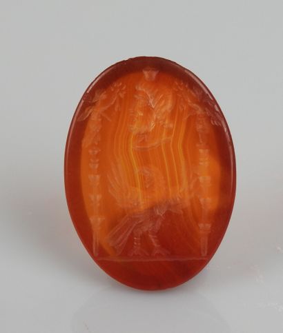 null Intaglio representing Serapis surmounting a rooster between two signs


Agate...