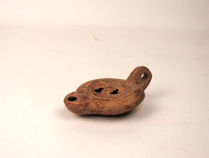 null Oil lamp with round spout with decoration representing two horns of plenty and...