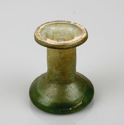 null Glass for ointments or perfumes in green iridescent glass,


Roman period.H...