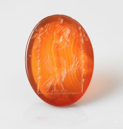 null Intaglio representing Serapis surmounting a rooster between two signs


Agate...