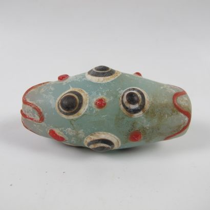 null Asia. China. Large tapered bead with 9 symbolic ocelli. Translucent glass paste...