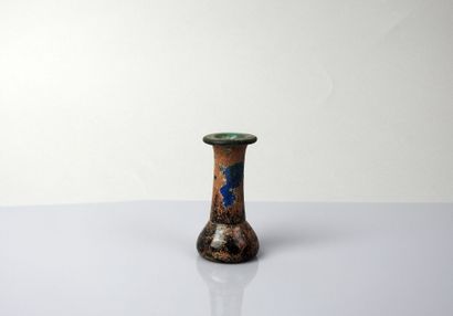 null Vase with long neck in very thick glass


Glass 7.5 cm


Roman or Islamic p...
