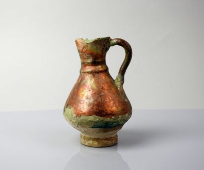 Nice glazed ceramic jug covering a blue-green...