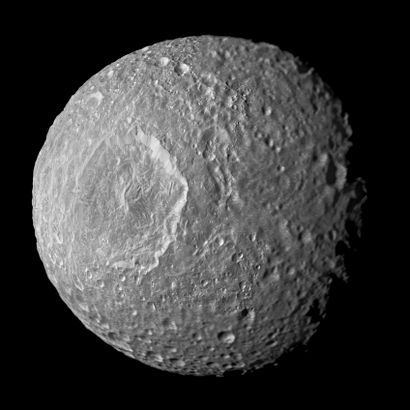 null Nasa. LARGE FORMAT. Photograph of the moon Mimas of the planet Saturn taken...