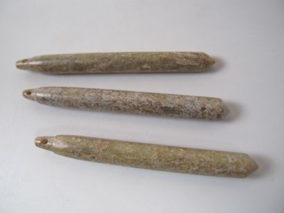null Three Neolithic jade pendants in the form of needles. Translucent yellow nephrite,...