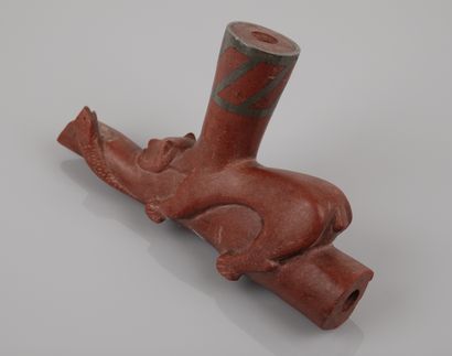 null Pipe bowl.

Animal probably an oppossum on a catlinite branch.

Lead hooping.

Cultures...