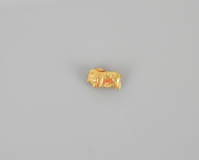 null Scythian or Sarmatian gold bead, circa 400 B.C., representing a stylized panther....
