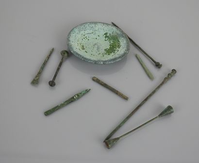 null Objects of medicine or surgery including a cup.

Bronze, Roman period.