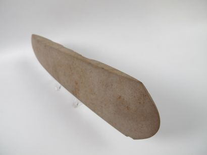 null Large votive polished axe with flat edges and double cutting edge. Beige stone...