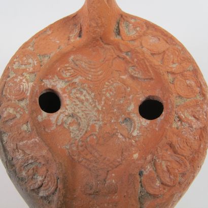 null Early Christian oil lamp with 1727ral motif. Orange terracotta. L 13.5cm. A...