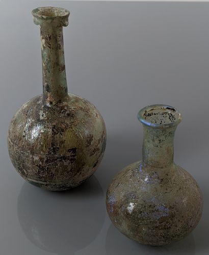 null Two glassworks: Large balsamaire with long straight neck with orbic body with...
