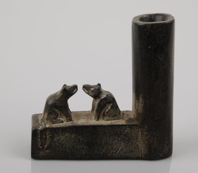 null Indian pipe bowl decorated with two wolves facing each other.probably shale.

US...