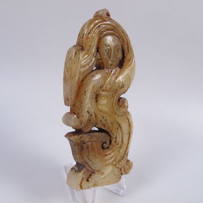 null Exceptional jade pendant with a celestial dancer. Translucent honey-colored...