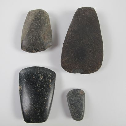 null Precolumbian. Four votive polished axes. Jade or other dark green hard stone...