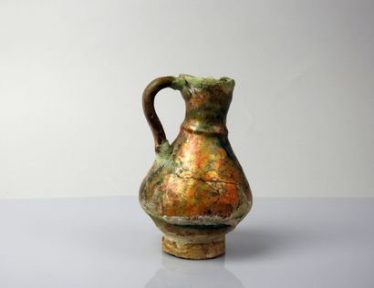 null Nice glazed ceramic jug covering a blue-green and black decoration

Terracotta...