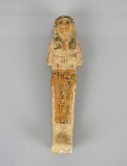 null Oushebti in polychrome carved wood.inscriptions in " T ".New Empire.

Concretions...