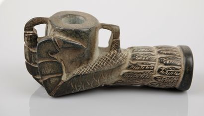 null Protome of pipe in the shape of a raptor's foot, the talons holding the cylindrical...