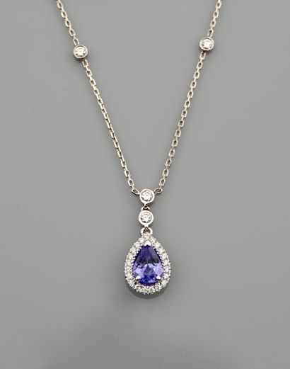 null Diamond necklace in white gold, 750 MM, centered on a pear-cut tanzanite weighing...