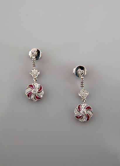 null Earrings in white gold, 750 MM, decorated with diamonds bearing a covered flower...