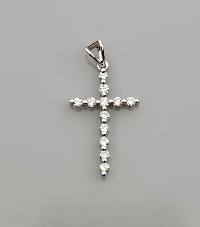 null Pendant in white gold cross, 750 MM, highlighted with diamonds total 0.35 carat,...