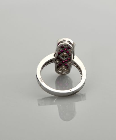 null Ring in white gold, 750 MM, drawing two crosses of calibrated rubies total 1...