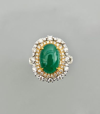 null White gold ring, 750 MM, centered on a cabochon emerald weighing 5.70 carats...