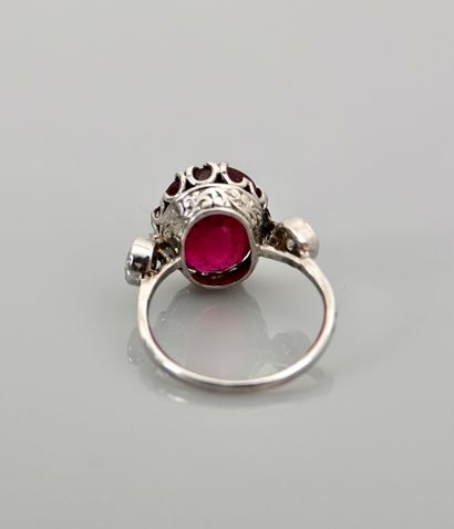 null White gold ring, 750 MM, set with an oval treated ruby weighing about 8 carats...
