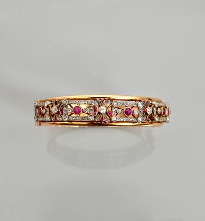 null Rigid opening bracelet in yellow gold, 750 MM, centered with rubies 1 carat...