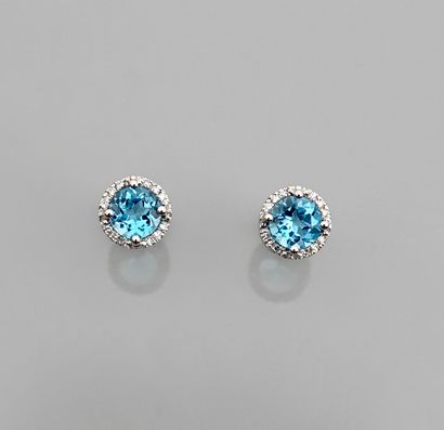 null Earrings in white gold, 750 MM, each set with a blue topaz weighing 1 carat...