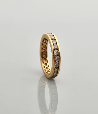 null Yellow gold wedding band, 750 MM, underlined with white stones, 1 carat approximately,...