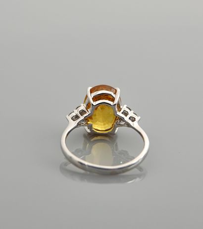 null Ring in white gold, 750 MM, set with a treated yellow sapphire weighing 5.21...