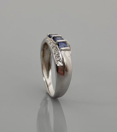 null Ring in white gold, 750 MM, set with three cut sapphires surrounded by diamonds,...