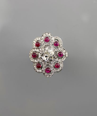 null White gold ring, 750 MM, set with eight cabochon rubies hemmed with diamonds...