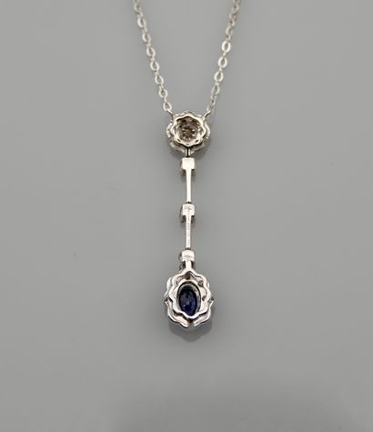 null Chain and pendant in white gold, 750 MM, decorated with a sapphire hemmed with...