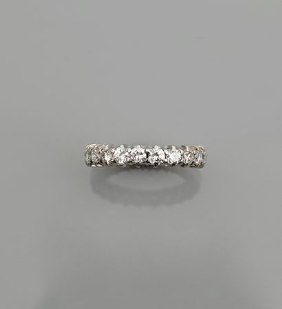 null White gold wedding band, 750 MM, highlighted with diamonds totaling 2 carats,...