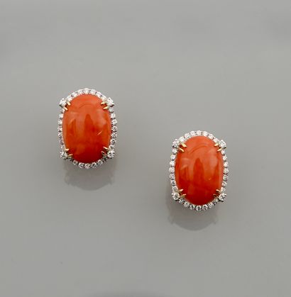 null Earrings in yellow gold, 750 MM, each set with a coral cabochon totaling 2 carats...