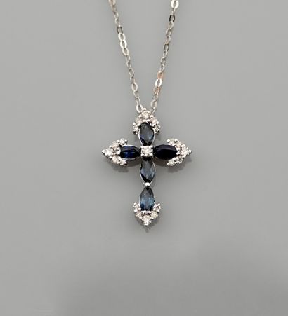 null Necklace in white gold, 750 MM, centered on a small cross highlighted with sapphires...