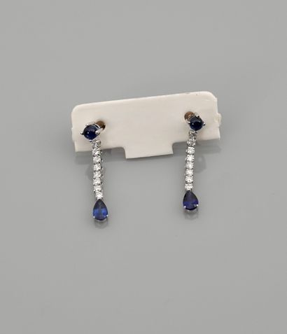 null Earrings in white gold, 750 MM, decorated with diamonds and sapphires totaling...