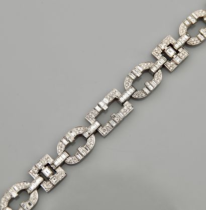 null Bracelet formed of twelve sections of white gold, 750 MM, highlighted with various...