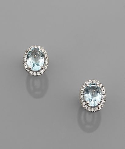 null Earrings in white gold, 750 MM, each centered with an aquamarine totaling 1.50...