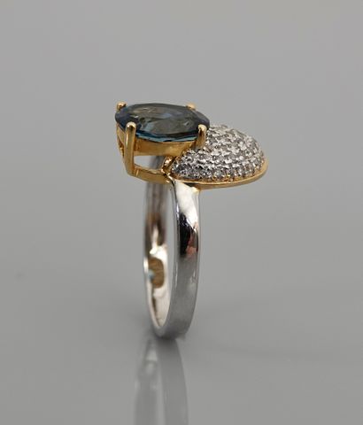 null Ring, silver 925 MM, vermeil, decorated with an oval blue topaz against a pavement...