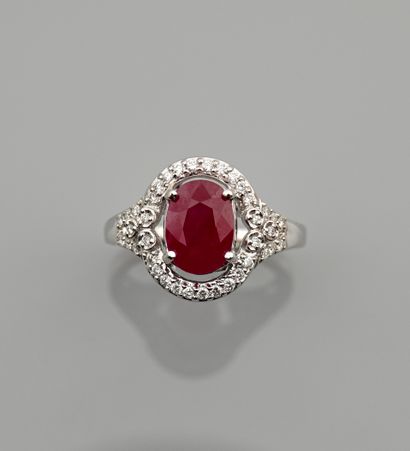 null White gold ring, 750 MM, centered with a Burmese ruby weighing about 3.20 carats,...