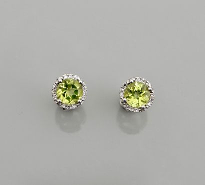 null Earrings in white gold, 750 MM, each set with a peridot weighing 1 carat finely...