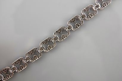 null Bracelet en or gris, 750 MM, formé de onze maillons ornés de diamants liés par...