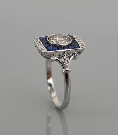 null Ring in white gold, 750 MM, centered on a diamond weighing 1.10 carats surrounded...