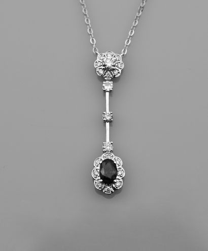 null Chain and pendant in white gold, 750 MM, decorated with a sapphire hemmed with...