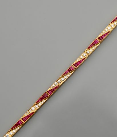 null Yellow gold bracelet, 750 MM, formed of sections covered with cut rubies, total...