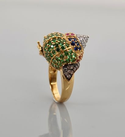 null Ring featuring a yellow gold snail, 750 MM, covered with tsavorites, rubies...